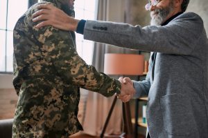 A veteran meeting with a therapist about CPTSD vs PTSD